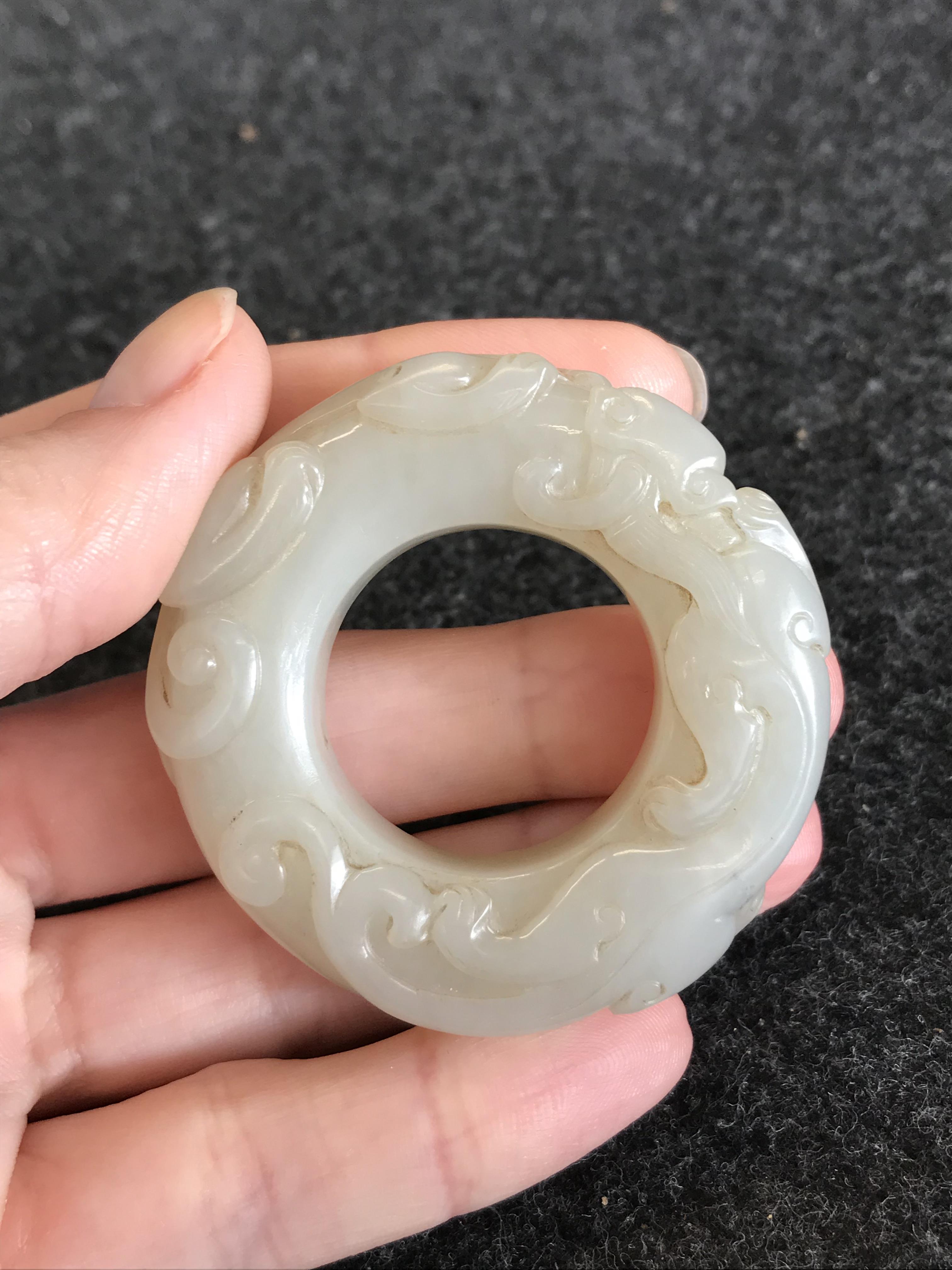 A CHINESE PALE CELADON JADE 'CHILONG' HUAN QING DYNASTY OR LATER Formed as a disc, carved in - Image 9 of 14