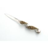 By Stuart Devlin, a modern parcel-gilt silver letter opener, London 1980, tapering form, with a