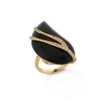 An onyx and diamond ring by Geoffrey Rowlandson, the teardrop-shaped onyx decorated with twisted
