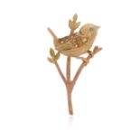 A gold bird brooch, the stylised bird set with citrines and an emerald eye on a bi-colour gold