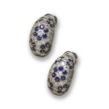A pair of French sapphire and diamond bombe earrings, set with sapphire flowerhead clusters within