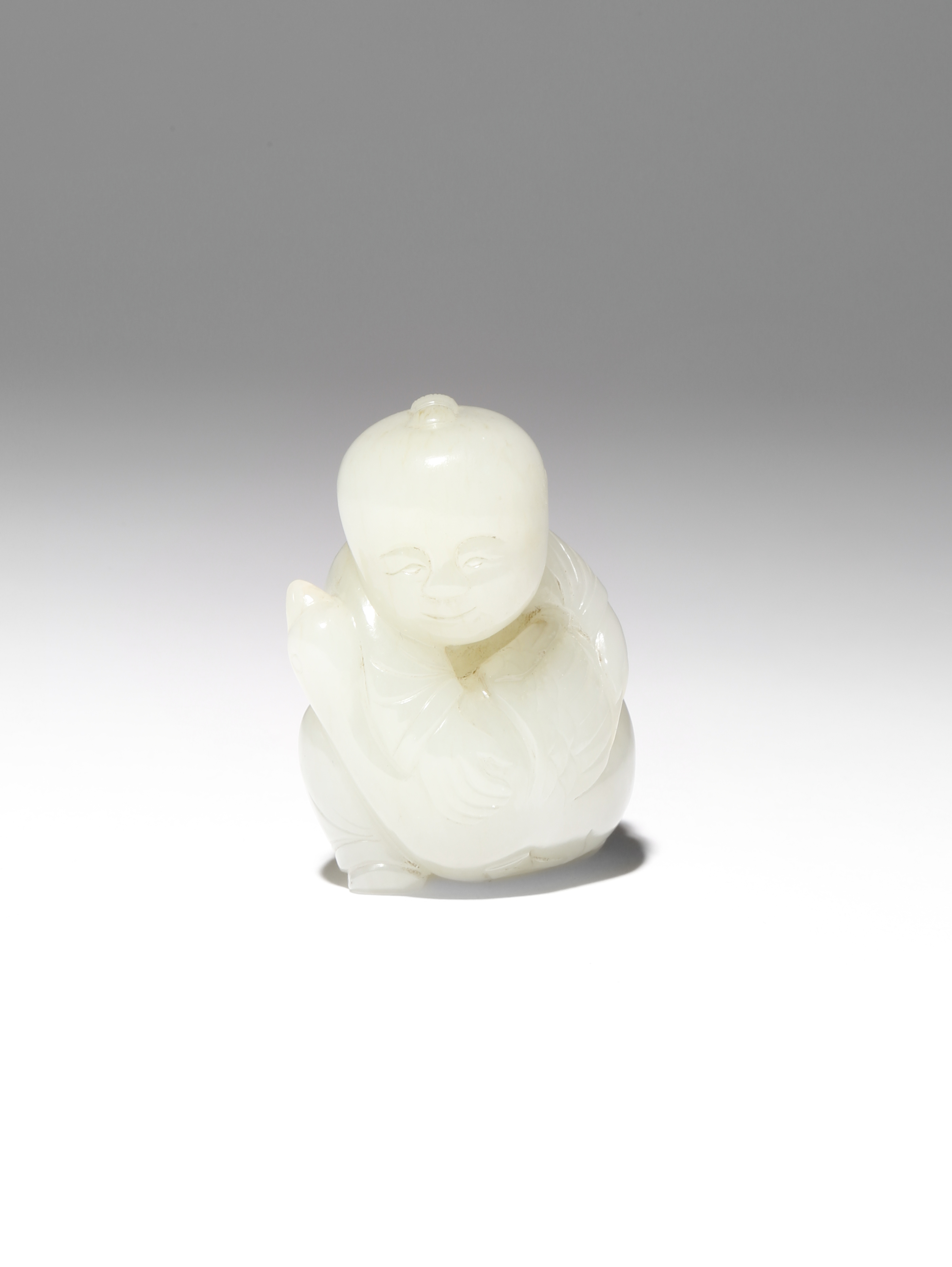 A SMALL CHINESE PALE CELADON JADE CARVING OF A BOY AND A GOOSE QING DYNASTY OR LATER The boy