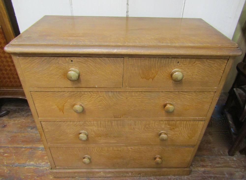A Victorian pine chest of three long and two short drawers, with original scumbled oak grain