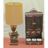 A table lamp in the form of a coffee grinding machine with mahogany base, together with an Italian