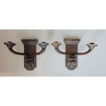 Pair of good quality carved oak twin scone wall lights, the sconces fitted to a mythical beast head,