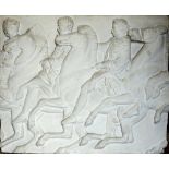 A large rectangular moulded plaster tablet with raised relief detail (copy of a section from the