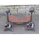 An Arts & Crafts cast iron and steel fire basket, the loose andirons with open spiral finials and