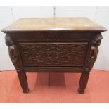 A small 18th century walnut coffer, the rising lid over a carved framework, with cherubs, characters