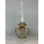 A cut glass suspended oil lamp with cast metal acanthus decoration, converted to electricity