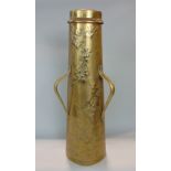 Art nouveau brass three handled tapered floor vase, embossed with floral sprays, 57cm high