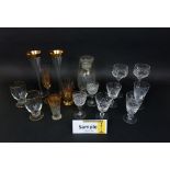 A mixed collection of glassware to include a cut glass goblet, sherry, wine and liquor glasses,