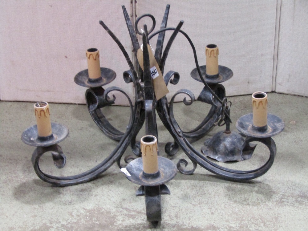 An iron work five branch hanging ceiling light with simple scroll and hammered detail, together with