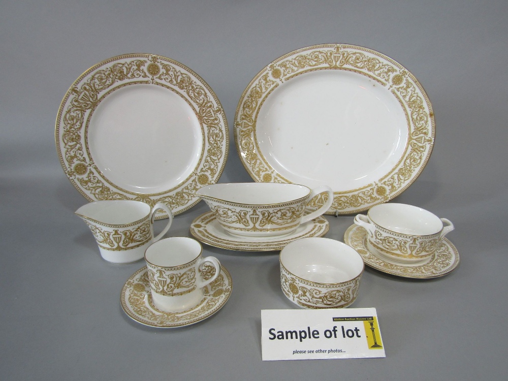 A quantity of Royal Worcester Hyde Park wares with gilt border decoration comprising two oval