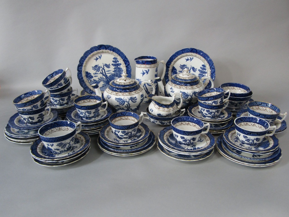 A quantity of Booths Real Old Willow pattern blue and white printed wares comprising two teapots,