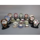 A collection of miniature early 19th century and later cups and saucers, coffee cans and saucers,