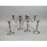 A pair of 19th century silver plated twin branch candelabra, together with a matched pair of