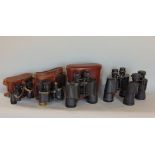 Five pairs of binoculars to include Zeiss Jenoptem 7 x 50 and four others, one pair with military