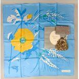 Silk scarf 77 x 77 cm, marked Christian Dior, blue with yellow flower design and rolled hems in