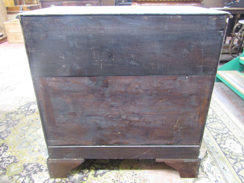 A Georgian chest of three long and two short drawer, raised on bracket supports, with later panted - Image 2 of 3