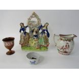 A 19th century Staffordshire Watch-holder with applied figures of three women, 31 cm, a 19th century