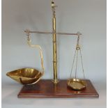 Pair of 19th century brass scales, upon a mahogany plinth base, 67cm high