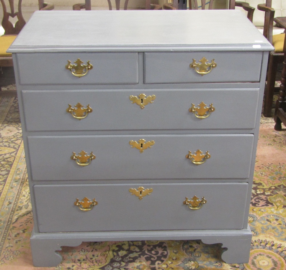 A Georgian chest of three long and two short drawer, raised on bracket supports, with later panted