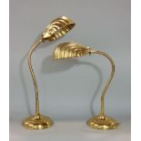 Pair of art deco brass snake desk lamps, with scallop shell shades and stepped circular bases,