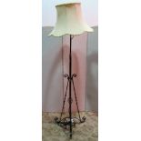 An iron work floor standing telescopic oil lamp standard, with simple scroll, copper flower head