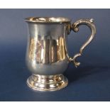 1930s antique style baluster tankard, with acanthus S scroll handle upon a stepped circular base,