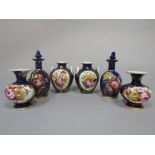 A collection of 19th century miniature blue ground vases comprising a pair of bottle shaped vases