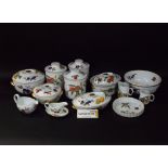 A collection of Royal Worcester Evesham wares including storage jars and covers, tureens and covers,