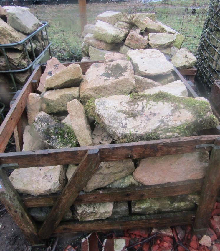 Two crates of limestone building stone, four square metres approx