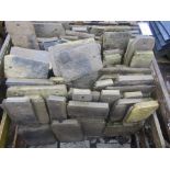 A crate of mixed weathered concrete tiles to simulate Cotswold stone, various sizes