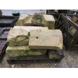 A pallet of large limestone building material