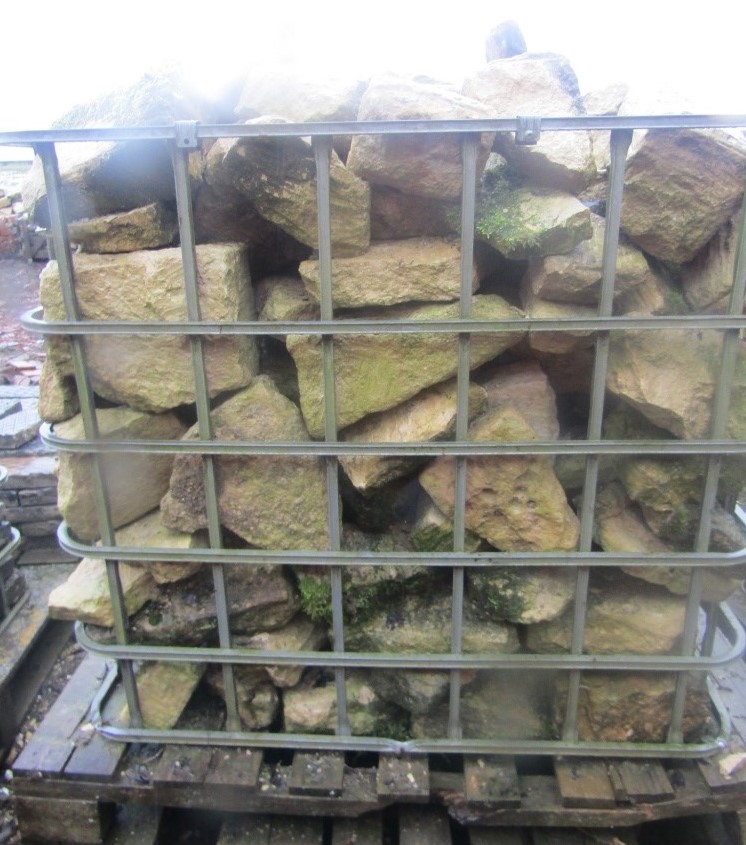 Two crates of limestone building stone, five square metres approx