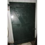 A panelled pine door, unused, further hardwood door, still climfilm wrapped and unglazed, further