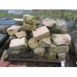 A pallet of limestone building stone, various sizes