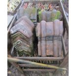 A crate of double approx 72 Roman tiles and further 15 Victorian ridge tiles T Hurst and Symons