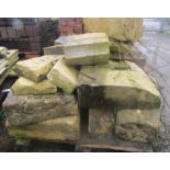 A pallet of limestone blocks including some Quoins, some moulded, etc