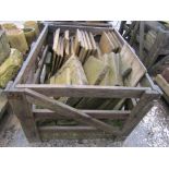 A crate of miscellaneous weathered concrete tiles, various sizes, limestone and other panels