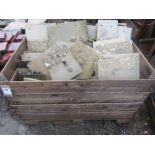 A crate of various weathered concrete tiles, various sizes