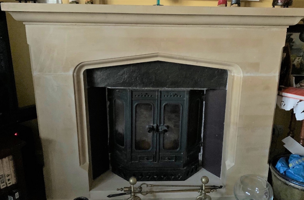 A reconstituted Tudor style fire surround in sections, max width 170cm