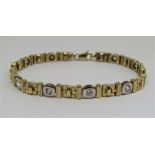 9ct bi-colour bracelet of geometric design set with paste, 16.6g