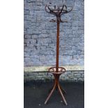 A vintage Bentwood freestanding hat and coat stand raised on swept supports