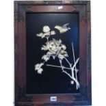 A pair of Japanese black lacquered panels of rectangular form, overlaid/mounted with floral bone