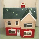 A scratch built dolls house with gabled roof and painted finish