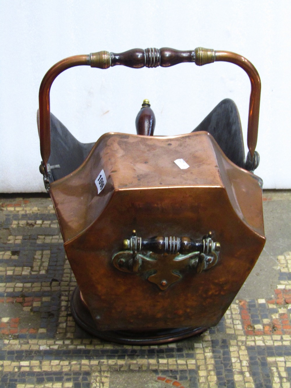 A 19th century copper helmet shaped coal scuttle with turned wooden hand grips together with - Image 2 of 2