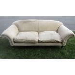 A contemporary but traditional style two to three seat sofa with cream ground chevron patterned