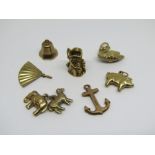 Group of 9ct novelty charms to include a hinged Toby jug, swan, pig, etc, 7.9g (7)