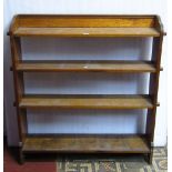 An oak floorstanding open bookcase with pegged shelves together with one other (2)